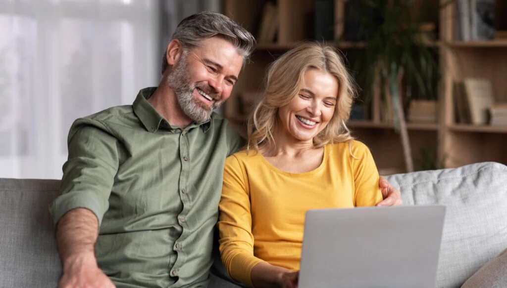 Homeowners looking at a laptop together